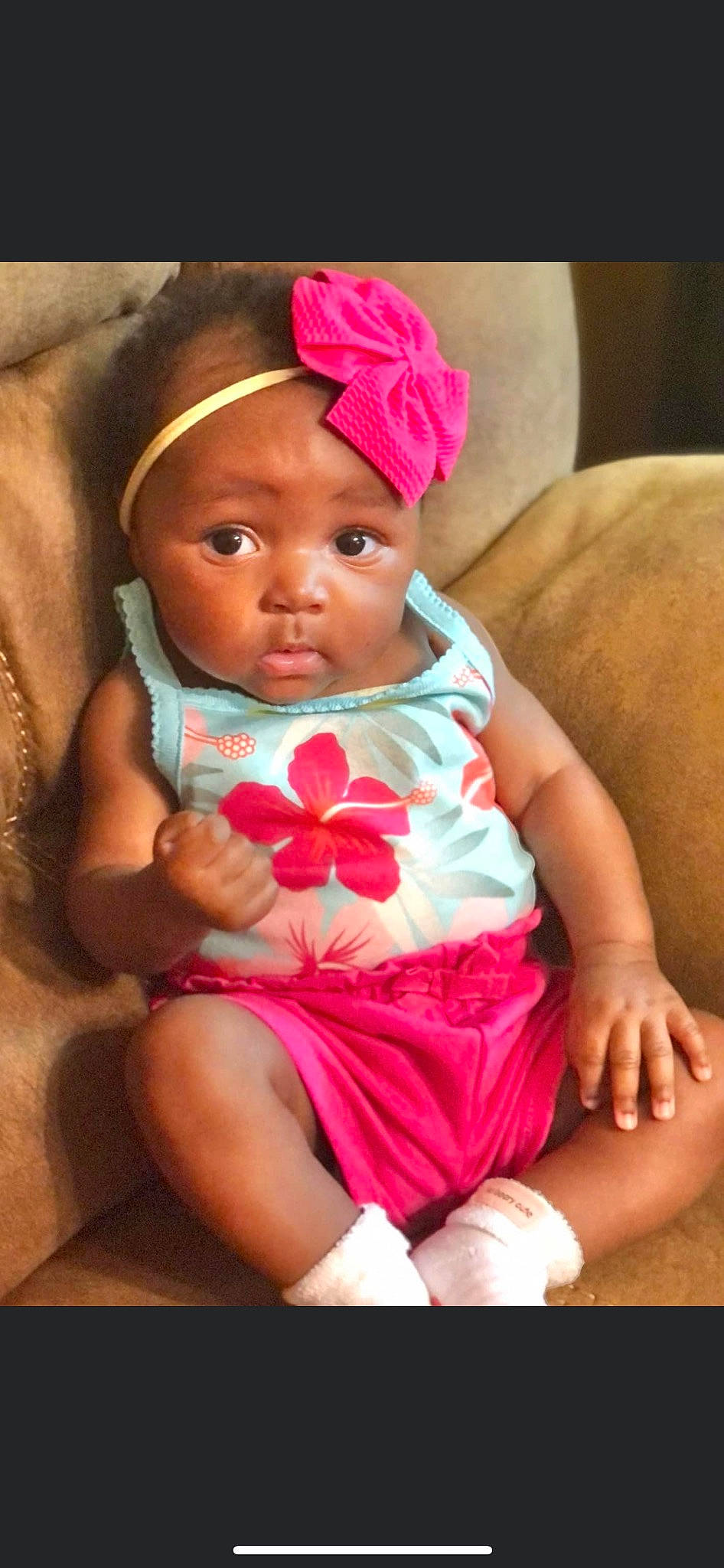 Leilani joined the competition — help win amazing prizes! baby, baby_products, baby_toddler_clothing, cap, child, comfort, dress, finger, happy, headpiece, headwear, iris, lip, magenta, mouth, nail, person, pink, sitting, skin