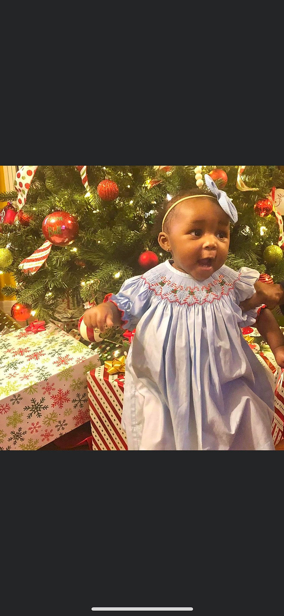 Leilani joined the competition — help win amazing prizes! adaptation, baby, baby_toddler_clothing, christmas, christmas_decoration, christmas_eve, christmas_ornament, christmas_tree, dress, event, fruit, happy, holiday, holiday_ornament, ornament, person, plant, table, toddler, tradition