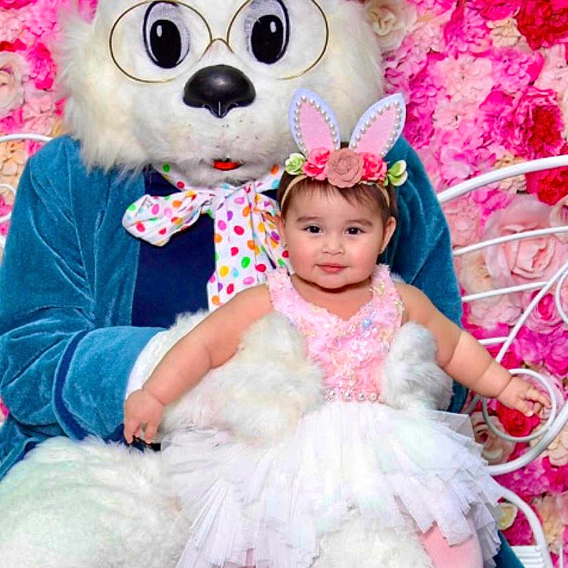Talia is registered to the contest to win money with this photo: accessories, baby, clothing, costume, couch, cushion, doll, dress, face, furniture, glasses, hat, head, homedecor, people, person, photography, portrait, purple, toy