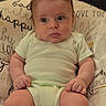 baby, infant, child, portrait, sitting, indoors, cushion, pillow, onesie, green_clothing, wide_eyes, facial_expression, spiky_hair, light_skin, arms, legs, hands, baby_furniture, home, photography
