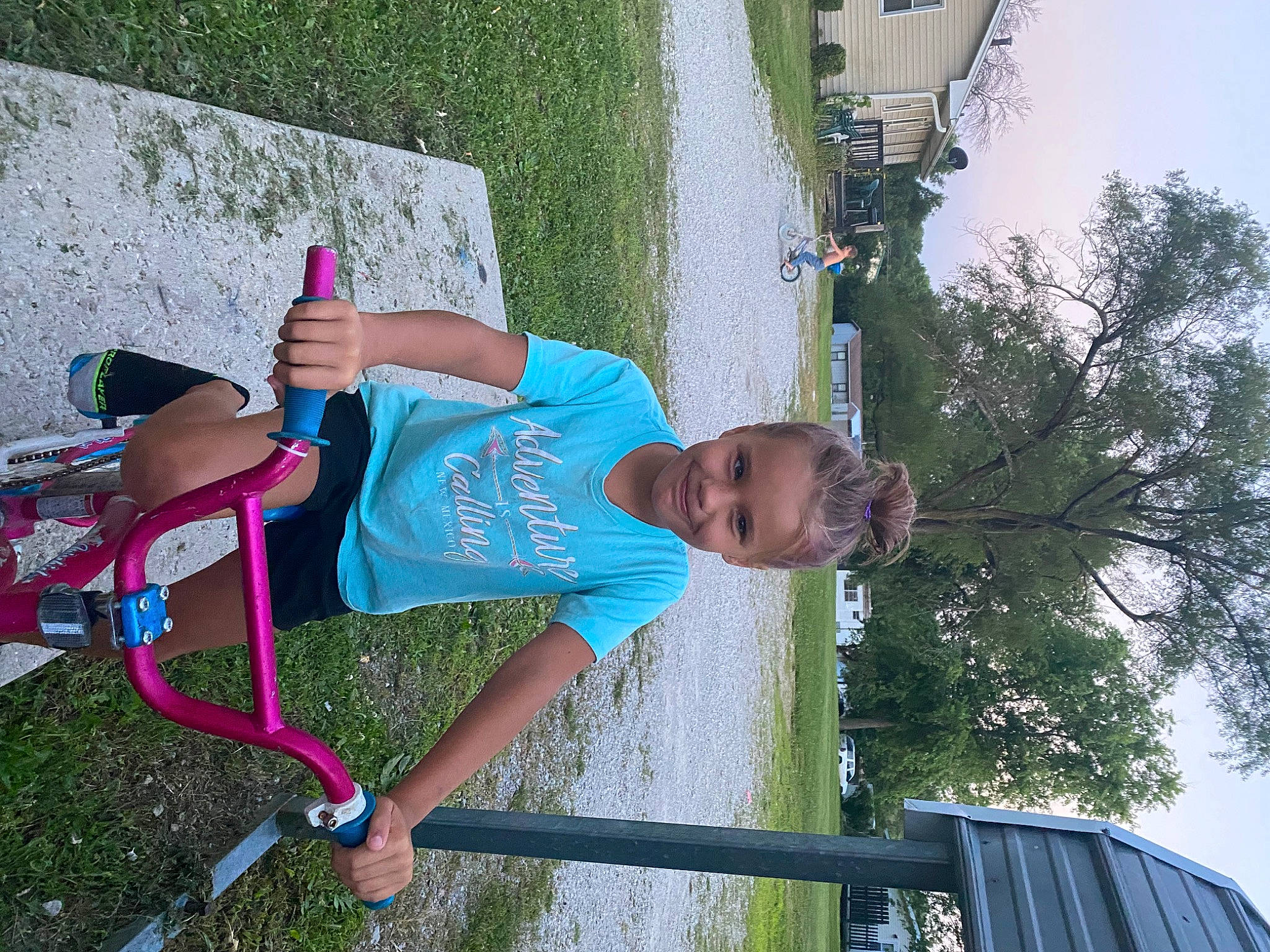 Braylee joined the competition — help win amazing prizes! bicycle_handlebar, child, fun, grass, happy, joy, leisure, magenta, person, plant, pole, recreation, shorts, sky, smile, t_shirt, toddler, tree, woody_plant