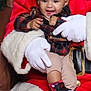 toddler, child, baby, smiling, santa_claus, holiday, christmas, beanie, plaid_shirt, sneakers, black_hat, white_gloves, red_suit, festive, happy, indoor, person, clothing, face, seated
