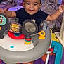 Anthony joined the competition — help win amazing prizes! baby, walker, child, toy, christmas_tree, holiday_lights, festive, smiling, indoors, colorful, floor_mat, socks, happy, playtime, decorations, celebration, person, young_child, cheerful, fun