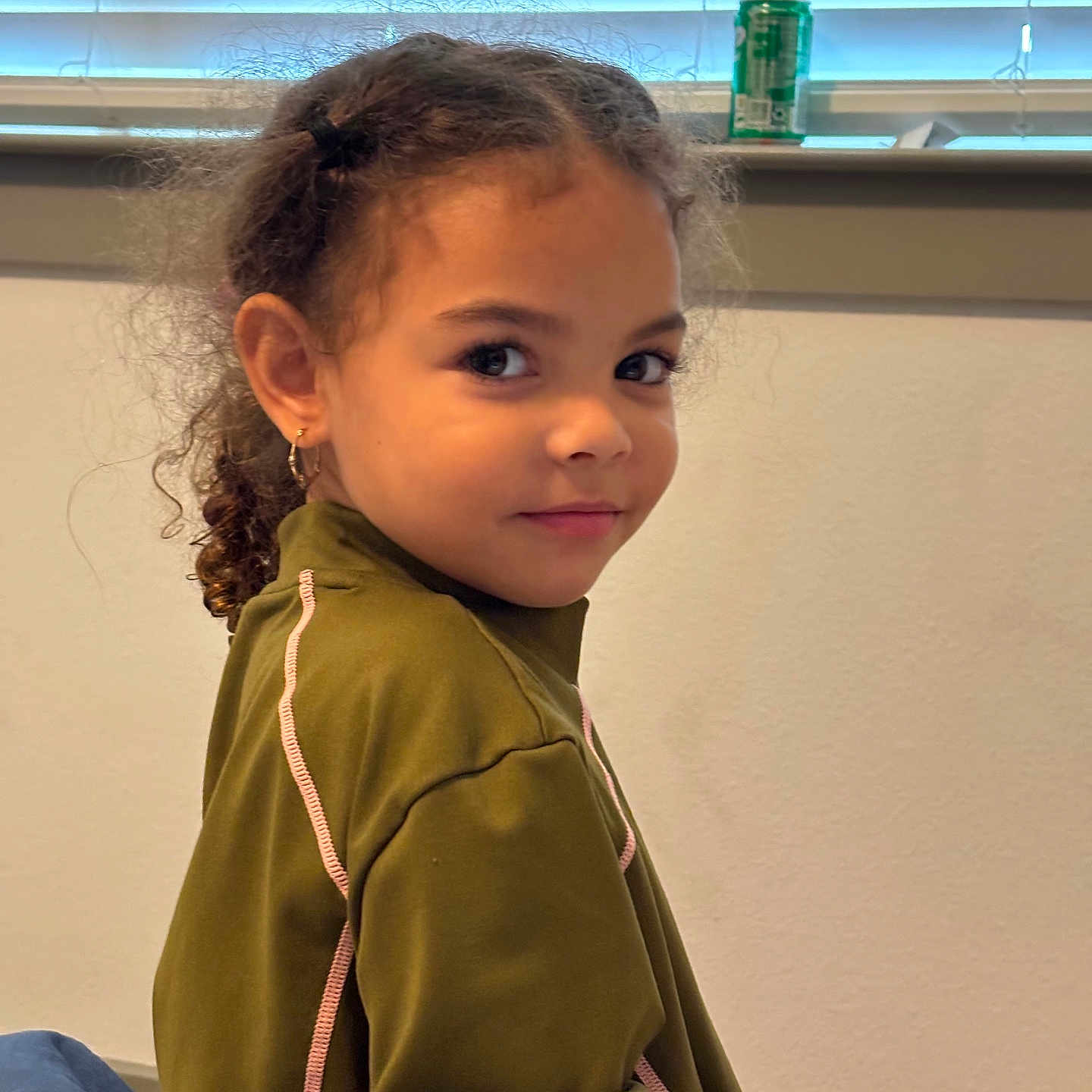 Hazel joined the competition — help win amazing prizes! bodypart, child, clothing, coat, curtain, face, female, finger, girl, hair, hand, happy, head, homedecor, jacket, person, photography, portrait, smile, windowshade