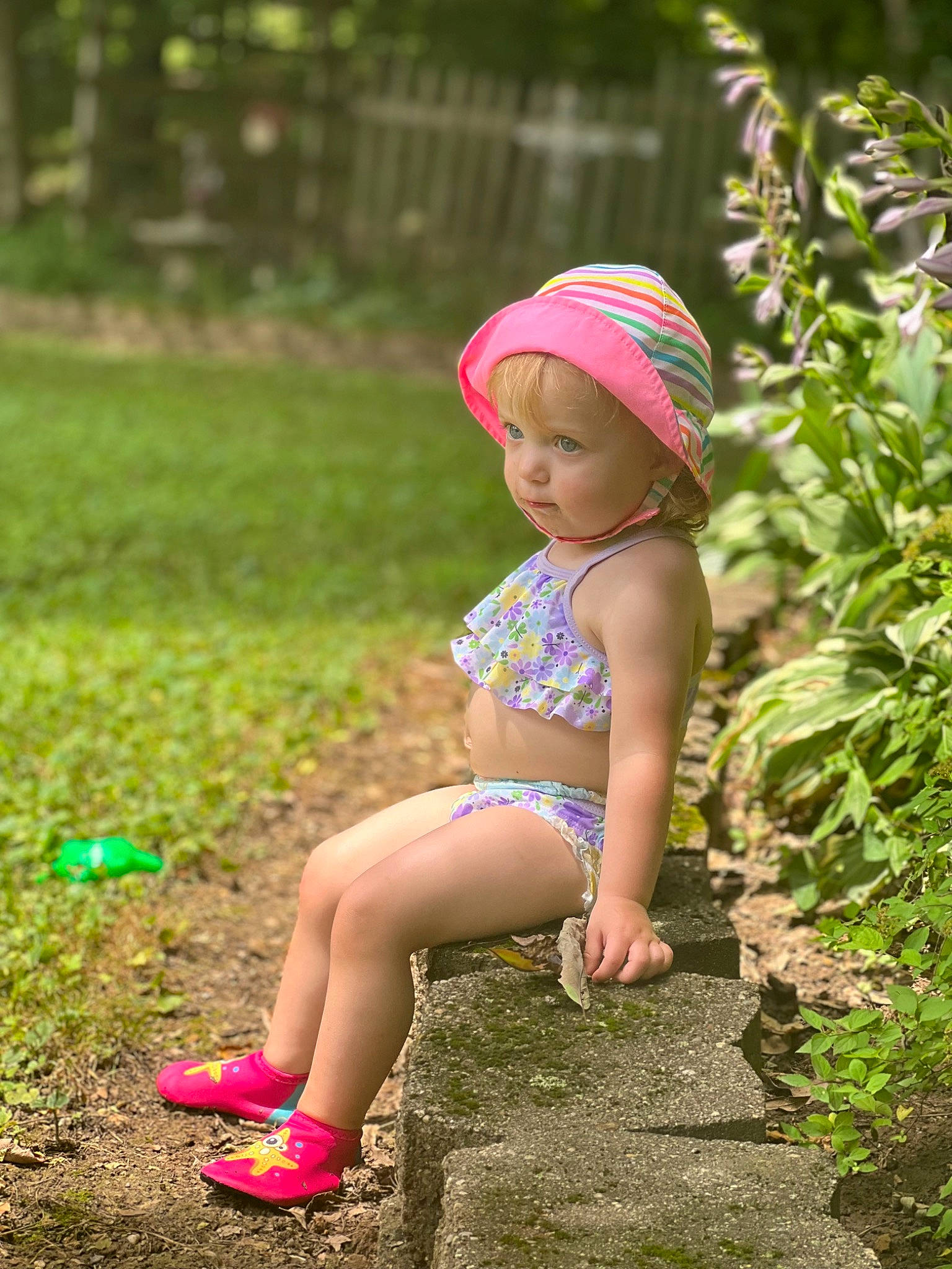 Hadleigh is registered to the contest to win money with this photo: baby, baby_toddler_clothing, cap, face, flash_photography, fun, grass, green, happy, headwear, leaf, leisure, meadow, natural_environment, people_in_nature, person, pink, plant, summer, sunlight