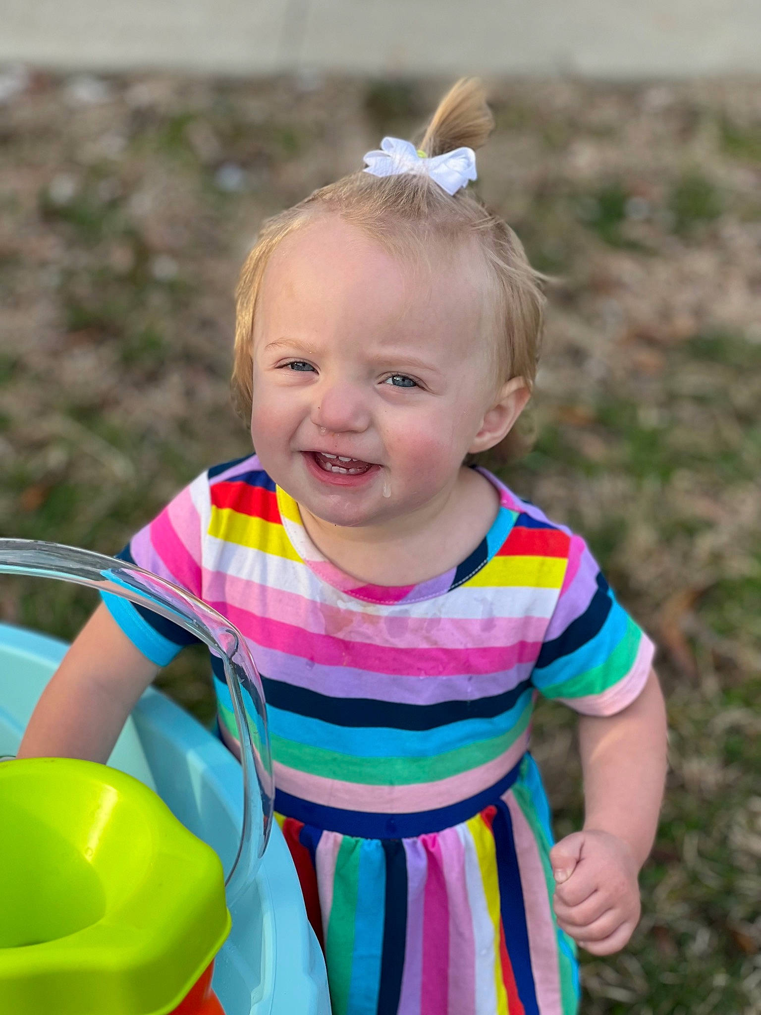 Hadleigh is registered to the contest to win money with this photo: baby, baby_toddler_clothing, child, dress, fun, grass, happy, human_body, iris, joy, leisure, people_in_nature, person, pink, recreation, sitting, skin, smile, spring, summer