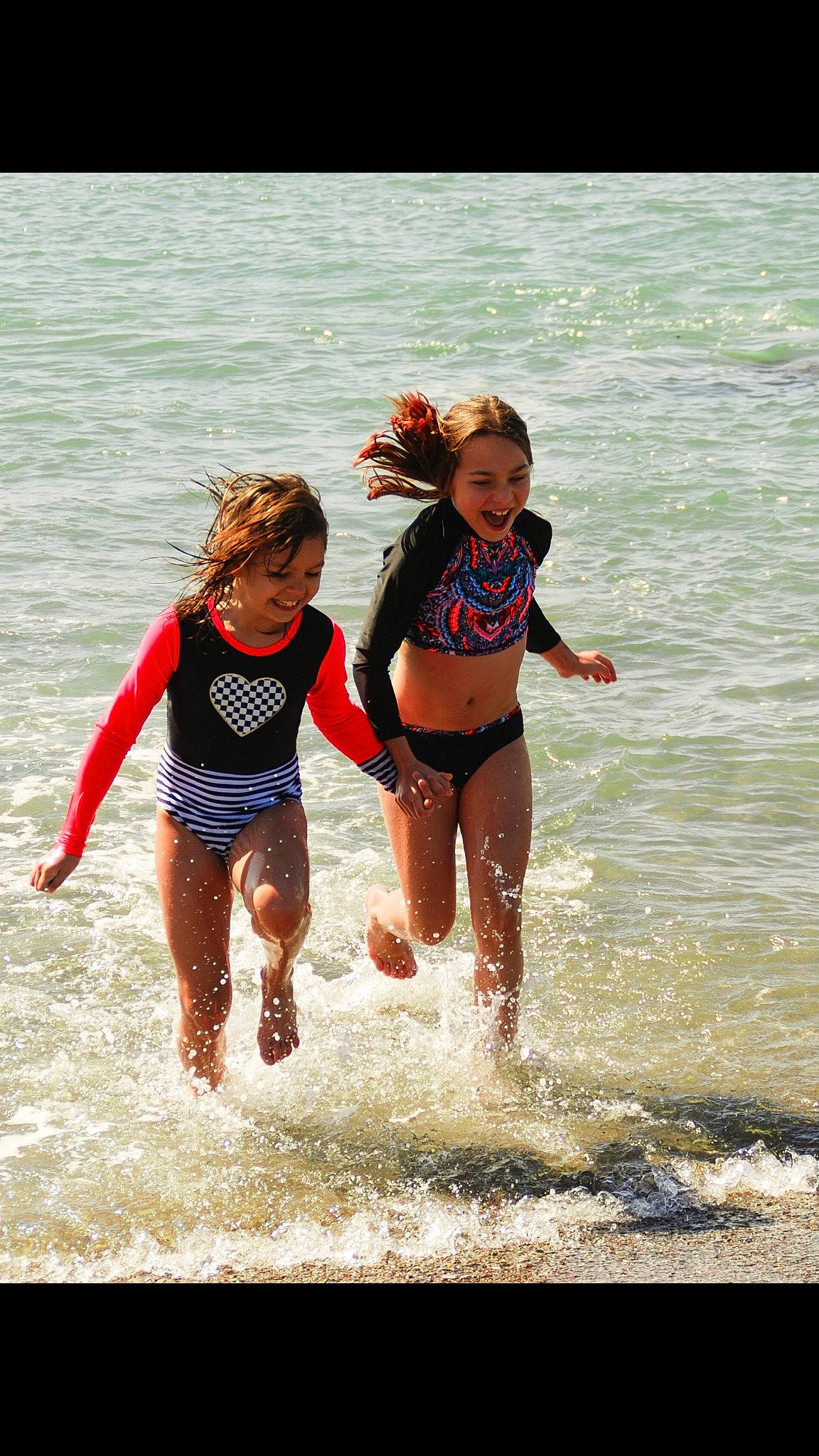 Macie  is registered to the contest to win money with this photo: beach, child, friendship, fun, happy, joy, leisure, ocean, people, person, photography, play, recreation, sea, smile, summer, toddler, vacation, water, wave
