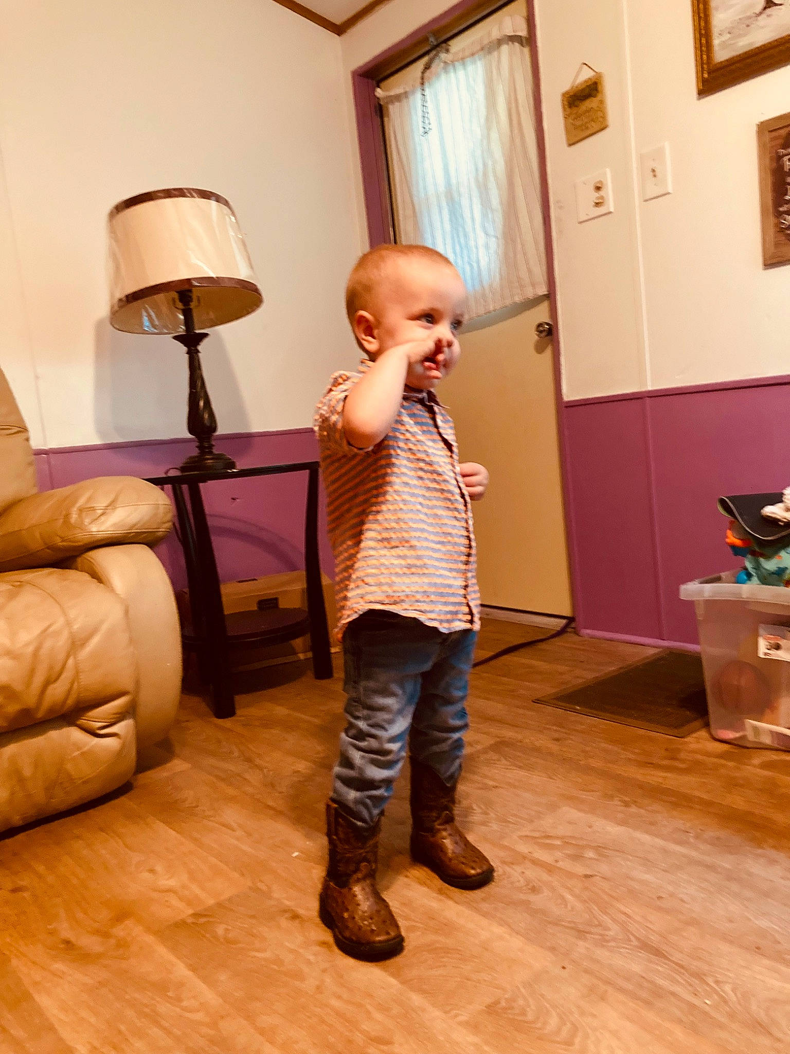 Kaiyden is registered to the contest to win money with this photo: comfort, door, floor, flooring, fun, hardwood, home, house, human_leg, laminate_flooring, lamp, living_room, person, picture_frame, tints_and_shades, toddler, varnish, window, wood, wood_flooring