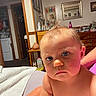 Freya is registered to the contest to win money with this photo: baby, bare_shoulders, bed, bedroom, blue_eyes, child, dresser, face, furniture, hair, home, indoors, infant, mirror, photography, portrait, serious_expression, sitting, skin, tufted_hair