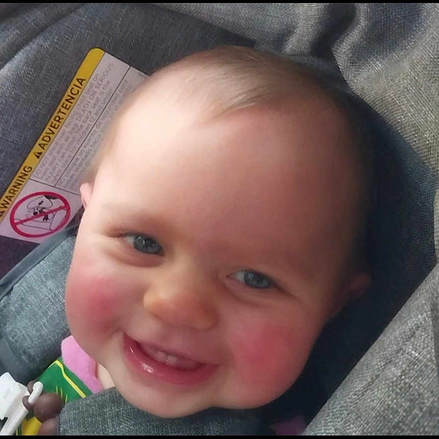Freya joined the competition — help win amazing prizes! baby, child, smile, car_seat, face, rosy_cheeks, blue_eyes, infant, cute, happy, portrait, seatbelt, clothing, head, person, indoors, closeup, child_seat, car, baby_toy