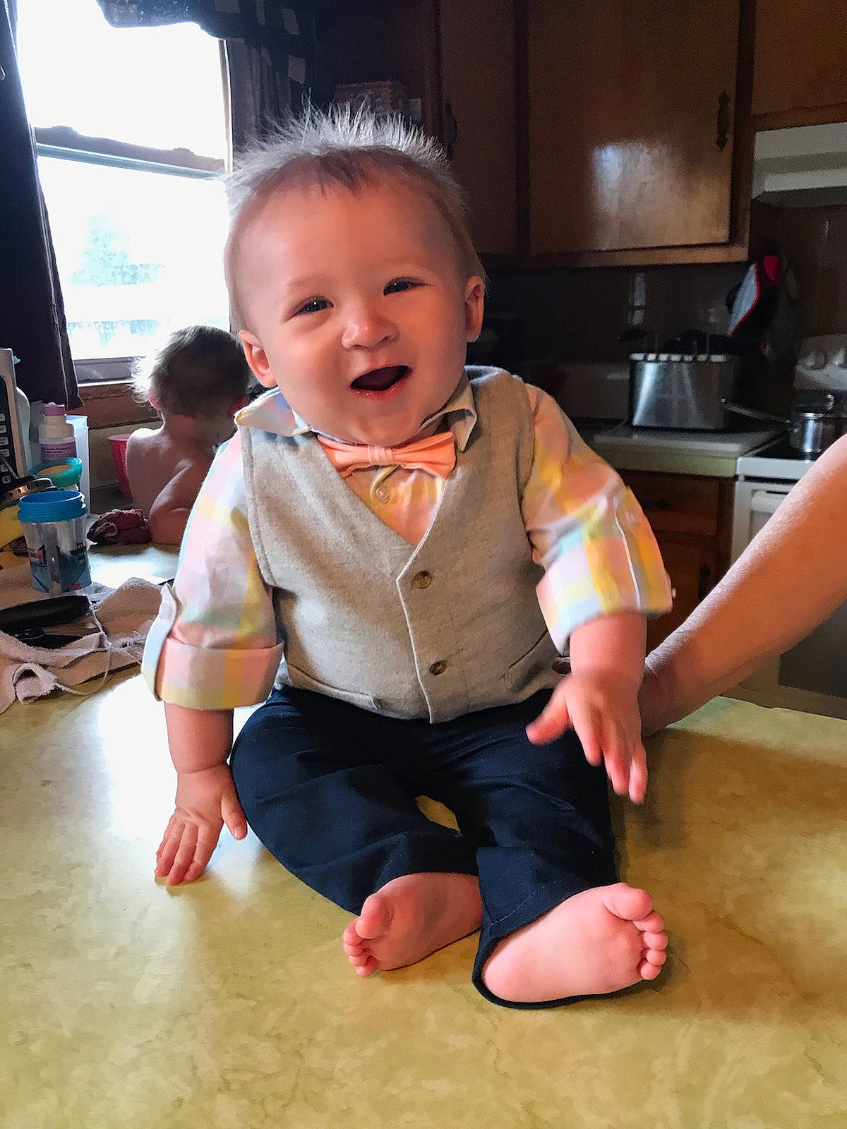 Abraham is registered to the contest to win money with this photo: baby, cheek, child, floor, flooring, person, sitting, skin, toddler