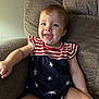 baby, infant, child, smiling, happy, sitting, armchair, clothing, stars, stripes, red, white, blue, face, tongue, cute, indoors, furniture, portrait, person