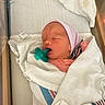 Tabitha joined the competition — help win amazing prizes! baby, bassinet, blanket, closed_eyes, cozy, face, hospital, infant, lying_down, medical_setting, newborn, nursery, pacifier, peaceful, photograph, pink_clothing, portrait, sleeping, striped_hat, swaddled