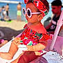 toddler, child, beach, sunglasses, headband, watermelon_pattern, summer, sunny, outdoor, fashion, person, earrings, skin, hand, foot, seat, accessory, vacation, relaxation, colorful