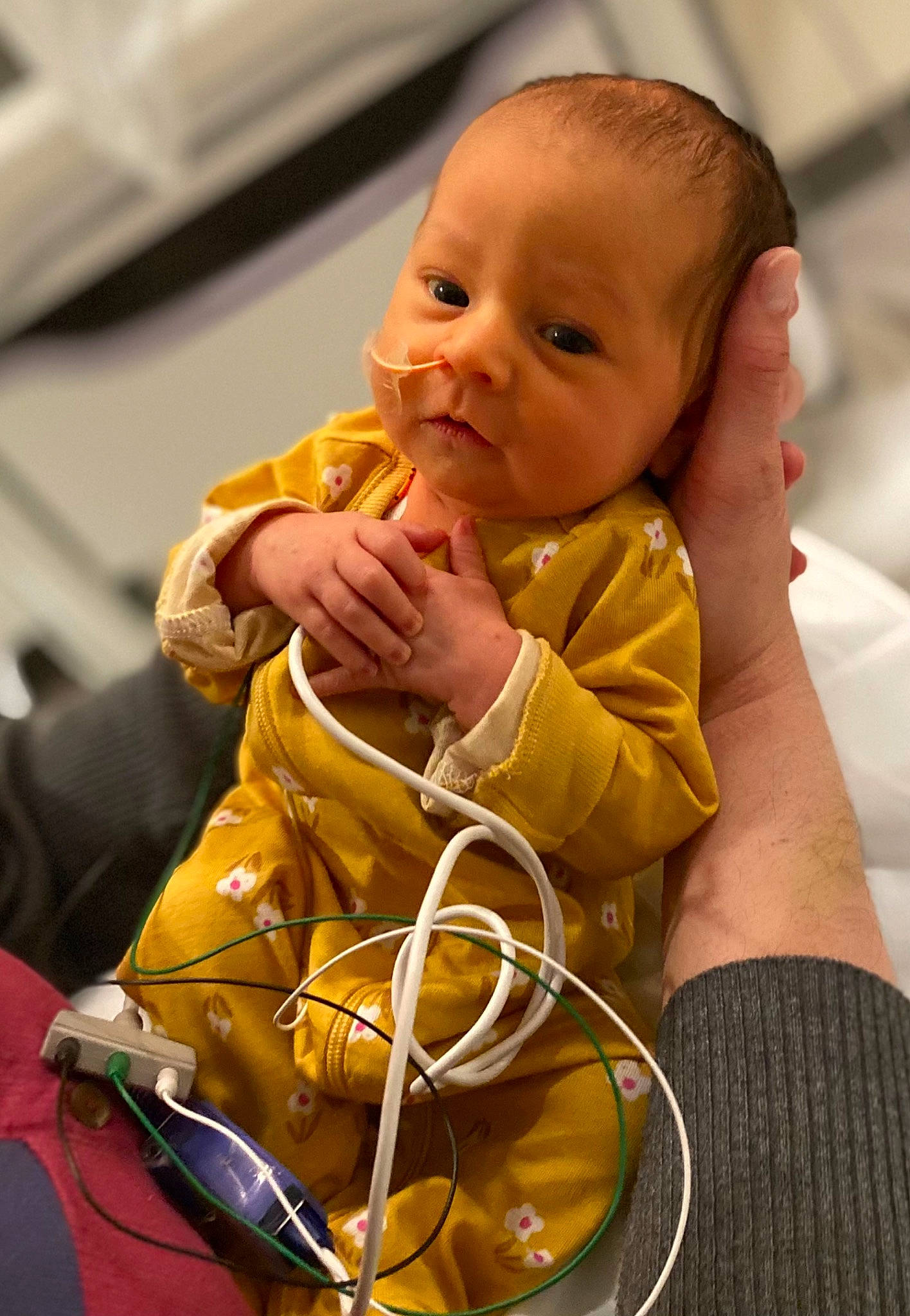 Raegan is registered to the contest to win money with this photo: baby, baby_products, baby_toddler_clothing, cheek, child, comfort, eye, facial_expression, finger, fun, gesture, happy, head, iris, lip, nose, person, sitting, skin, thumb