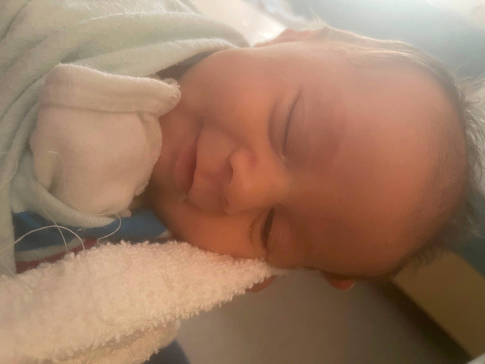 Raegan joined the competition — help win amazing prizes! baby, baby_sleeping, cheek, child, chin, close_up, comfort, ear, eyebrow, eyelash, facial_expression, finger, happy, iris, lip, mouth, nose, person, skin, textile