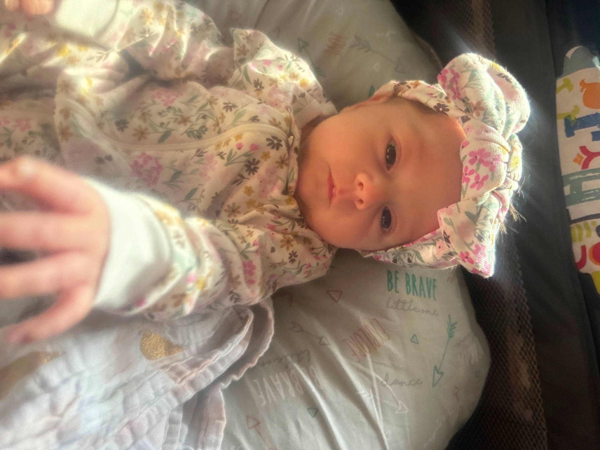 Raegan is registered to the contest to win money with this photo: baby, baby_products, baby_toddler_clothing, bedding, bedtime, cheek, child, comfort, eye, fur, head, headwear, iris, linens, nap, pattern, person, room, sitting, sleep