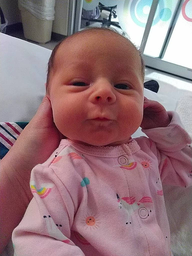 Raegan joined the competition — help win amazing prizes! baby, baby_products, baby_toddler_clothing, bib, cheek, child, chin, comfort, eyelash, happy, iris, lip, mouth, neck, nose, person, pink, skin, sleeve, smile