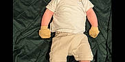 Luca Allan Hendrix is registered to the contest to win money with this photo: baby, infant, child, lying_down, blanket, quilted, clothing, white_shirt, beige_shorts, mittens, brown_shoes, milestone_sign, winnie_the_pooh, piglet, smiling, portrait, indoors, cute, happy, three_months