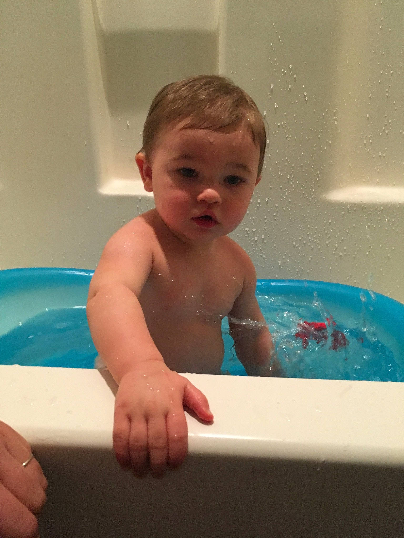 Fisher is registered to the contest to win money with this photo: baby, baby_bathing, bathing, bathtub, child, fun, leisure, person, plumbing_fixture, toddler, washing