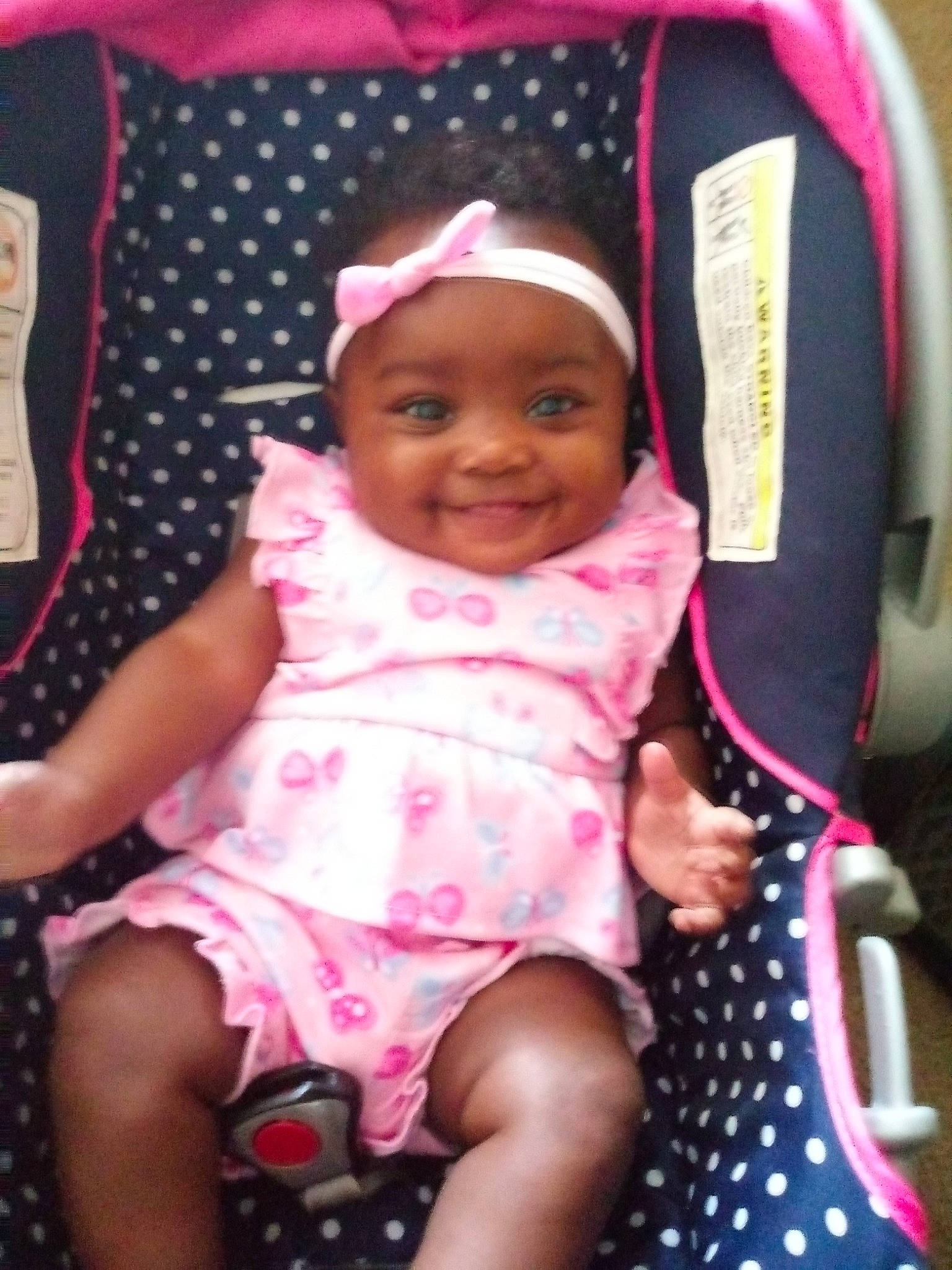 Ari'Yanna is registered to the contest to win money with this photo: baby, baby_carriage, baby_products, car_seat, child, design, headwear, joy, magenta, pattern, person, pink, polka_dot, product, toddler