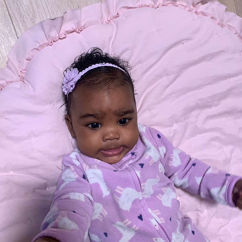 Ava joined the competition — help win amazing prizes! baby, bed, bodypart, bonnet, clothing, couch, crib, face, finger, furniture, hand, happy, hat, head, infantbed, newborn, person, photography, portrait, smile