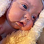 Jazmine joined the competition — help win amazing prizes! baby, infant, face, closeup, blue_eyes, blanket, soft_texture, skin, newborn, portrait, child, cute, sleepy, warm, cozy, expression, human, wrapped, resting, indoors