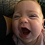 Jazmine is registered to the contest to win money with this photo: baby, close_up, smiling, face, infant, indoor, person, joyful, expression, couch, pattern, happy, child, young, cute, skin, head, mouth, eyes, clothing