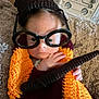 baby, child, glasses, knit_blanket, orange, brown, carpet, indoor, closeup, face, hand, cozy, novelty_glasses, infant, cute, expression, person, portrait, warm, soft