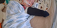 Larry is registered to the contest to win money with this photo: baby, bed, blanket, child, comfort, crib, cute, groot, healthcare, hospital, indoor, infant, medical, nasal_tube, peaceful, plush_toy, resting, sleeping, soft, swaddled