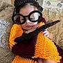 Larry joined the competition — help win amazing prizes! baby, blanket, child, costume, crocheted, cute, expression, face, glasses, hand, hat, indoor, infant, knitted, lying_down, portrait, scarf, soft_texture, toy, wand