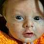 Larry is registered to the contest to win money with this photo: baby, child, close_up, curious, cute, expression, face, fingers, hand, indoor, infant, knitwear, looking, mouth_open, orange_clothing, portrait, skin, soft_light, wide_eyes, young