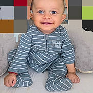 Leeroy participe au concours pour gagner de l'argent avec cette photo : baby, smiling, child, onesie, striped_clothing, blue_eyes, sitting, plush_cushion, indoor, happy, cute, portrait, infant, soft_fabric, hands, feet, cozy, face, person, young_child