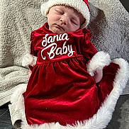 Catalyna a rejoint le concours — aidez-le/la à gagner de superbes lots ! baby, sleeping, red_dress, santa_hat, holiday, christmas, festive, soft_blanket, infant, cute, white_trim, cozy, portrait, indoor, child, celebration, holiday_outfit, smiling_face, adorable, peaceful