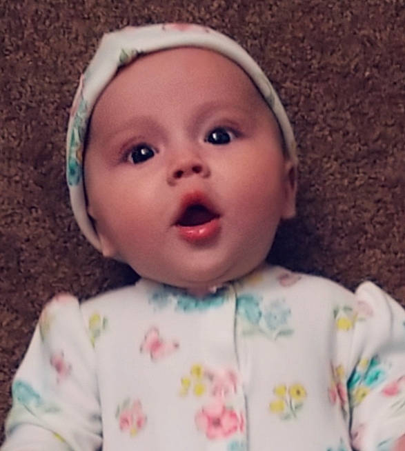 Annalisa is registered to the contest to win money with this photo: baby, baby_making_funny_faces, cheek, child, chin, eye, eyebrow, face, facial_expression, forehead, head, headgear, iris, lip, mouth, nose, person, pink, skin, smile