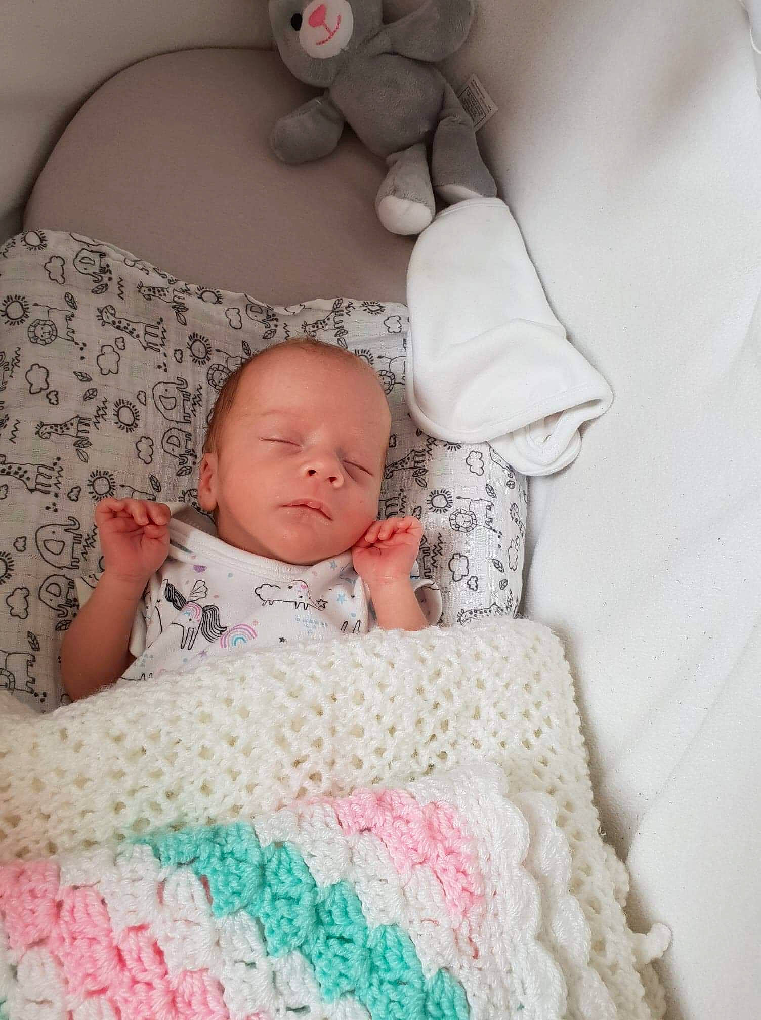 Isla is registered to the contest to win money with this photo: baby, baby_sleeping, bedding, blanket, cheek, child, crochet, knitting, linens, pattern, person, photograph, pink, product, room, skin, sleep, smile, textile, toddler