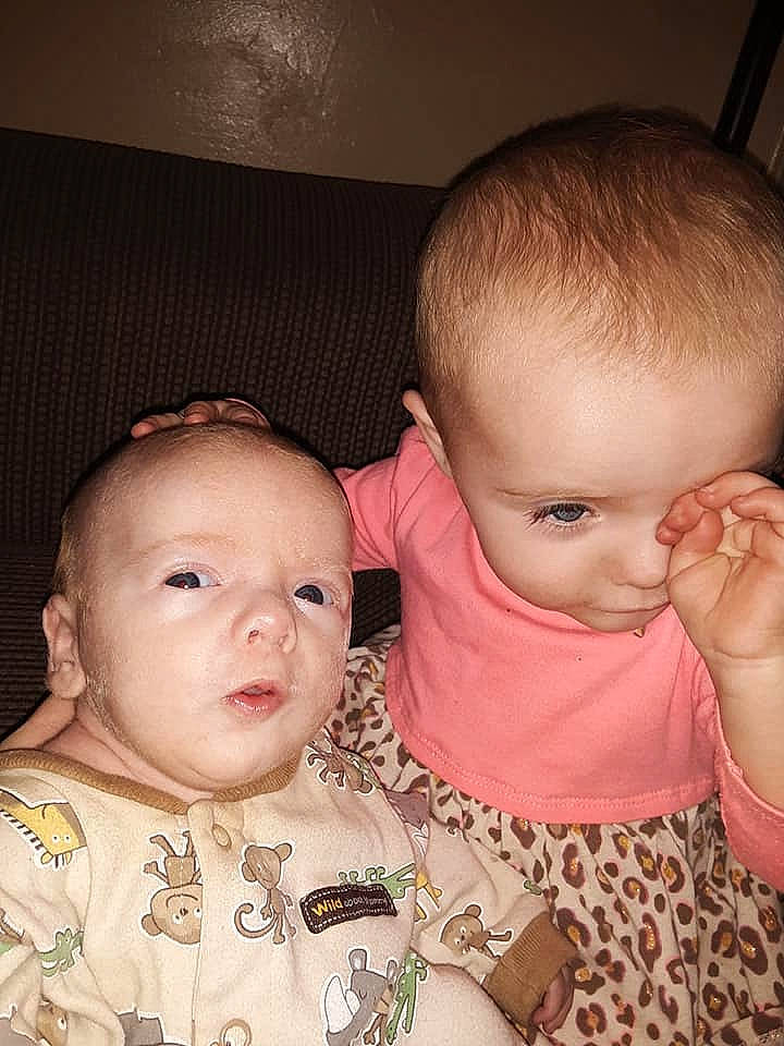 Judy is registered to the contest to win money with this photo: baby, cheek, child, chin, ear, eye, face, forehead, fun, head, interaction, iris, lip, nose, organ, people, person, pink, skin, smile