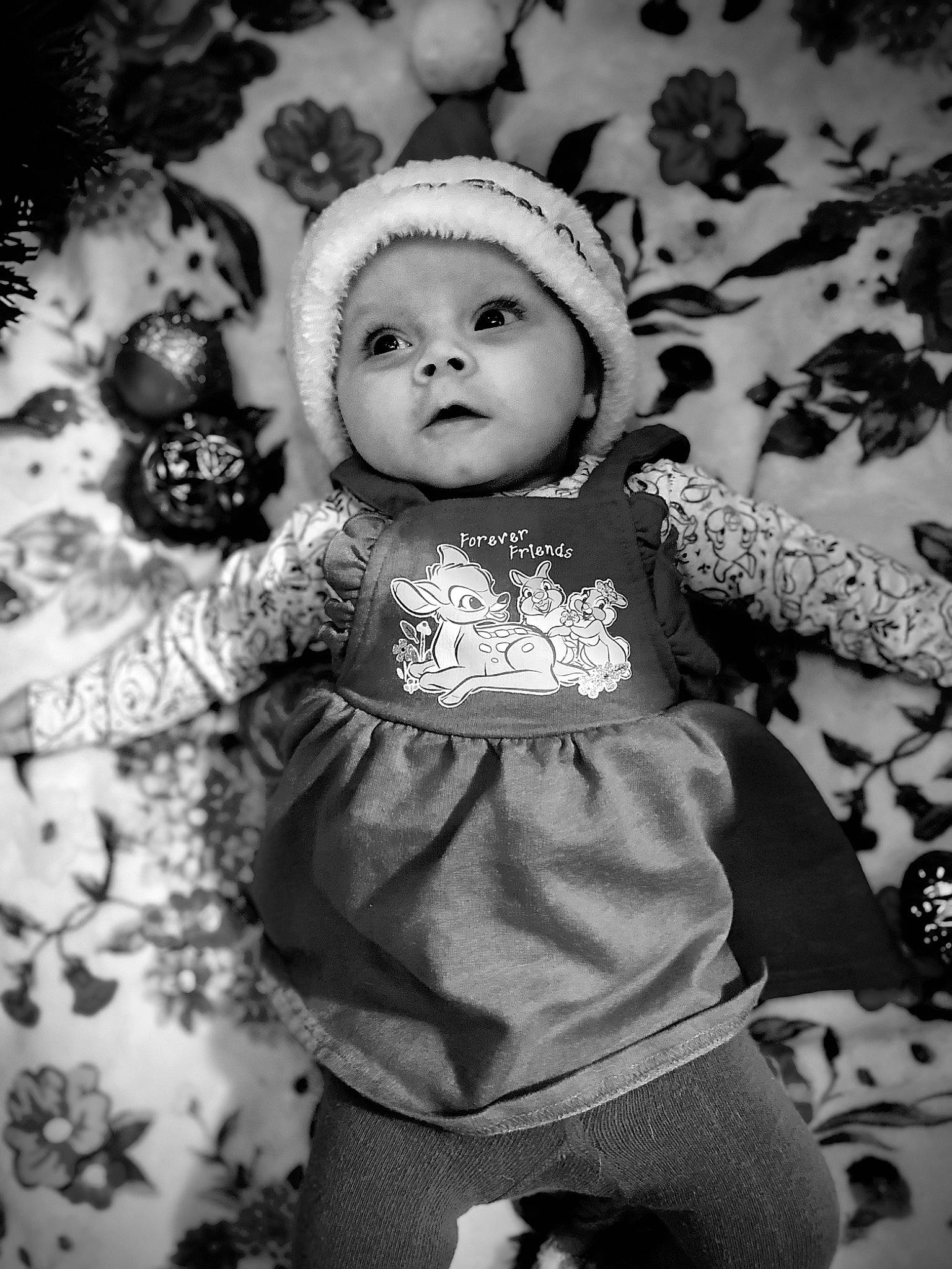 Marceline is registered to the contest to win money with this photo: baby_toddler_clothing, black, black_and_white, cheek, child, doll, dress, event, flash_photography, fun, happy, headwear, monochrome, monochrome_photography, organ, pattern, person, style, textile, toy