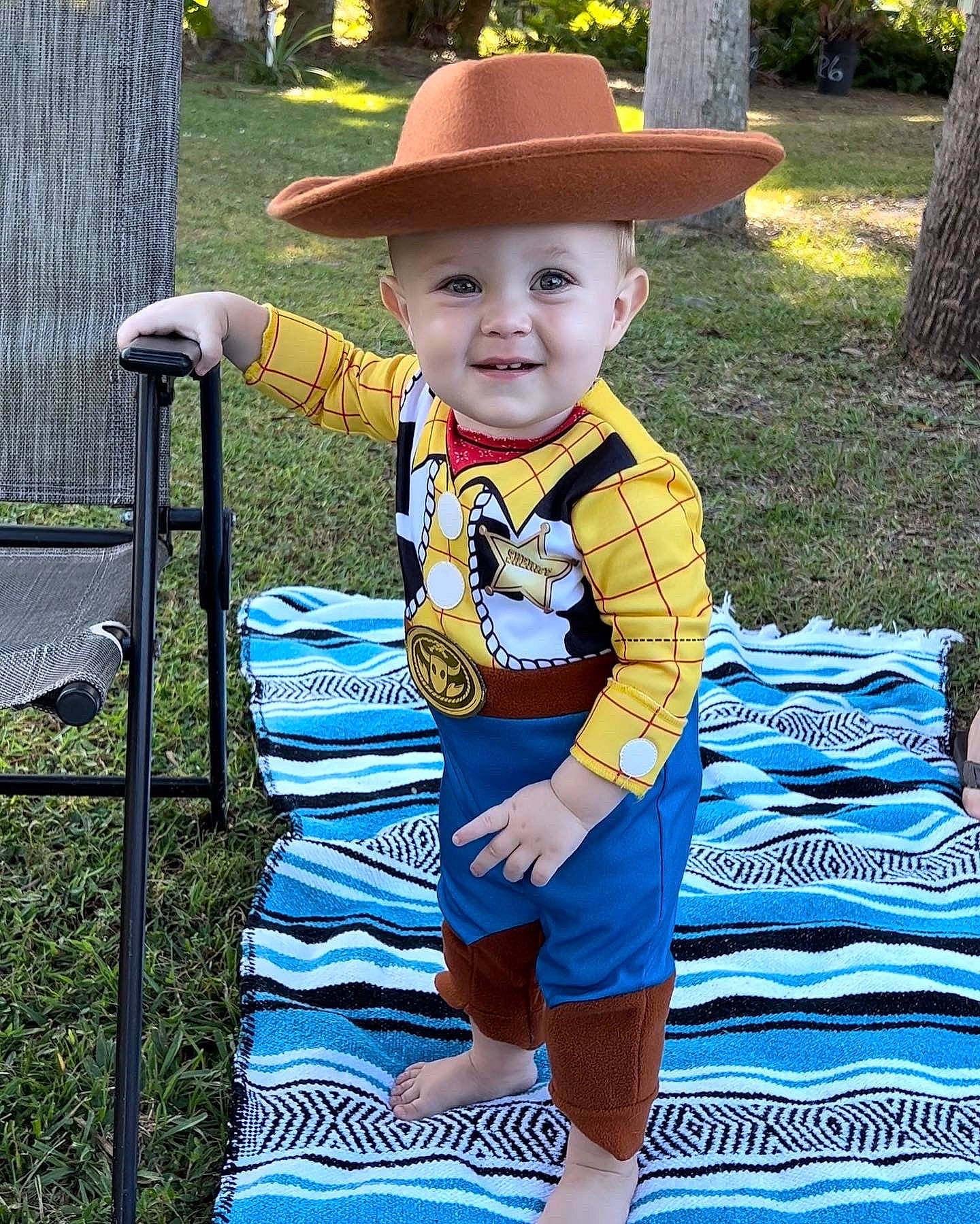 Eli joined the competition — help win amazing prizes! baby_toddler_clothing, child, costume_hat, electric_blue, event, face, fashion_accessory, fun, grass, happy, hat, headwear, joy, leisure, pattern, person, plant, recreation, sleeve, smile