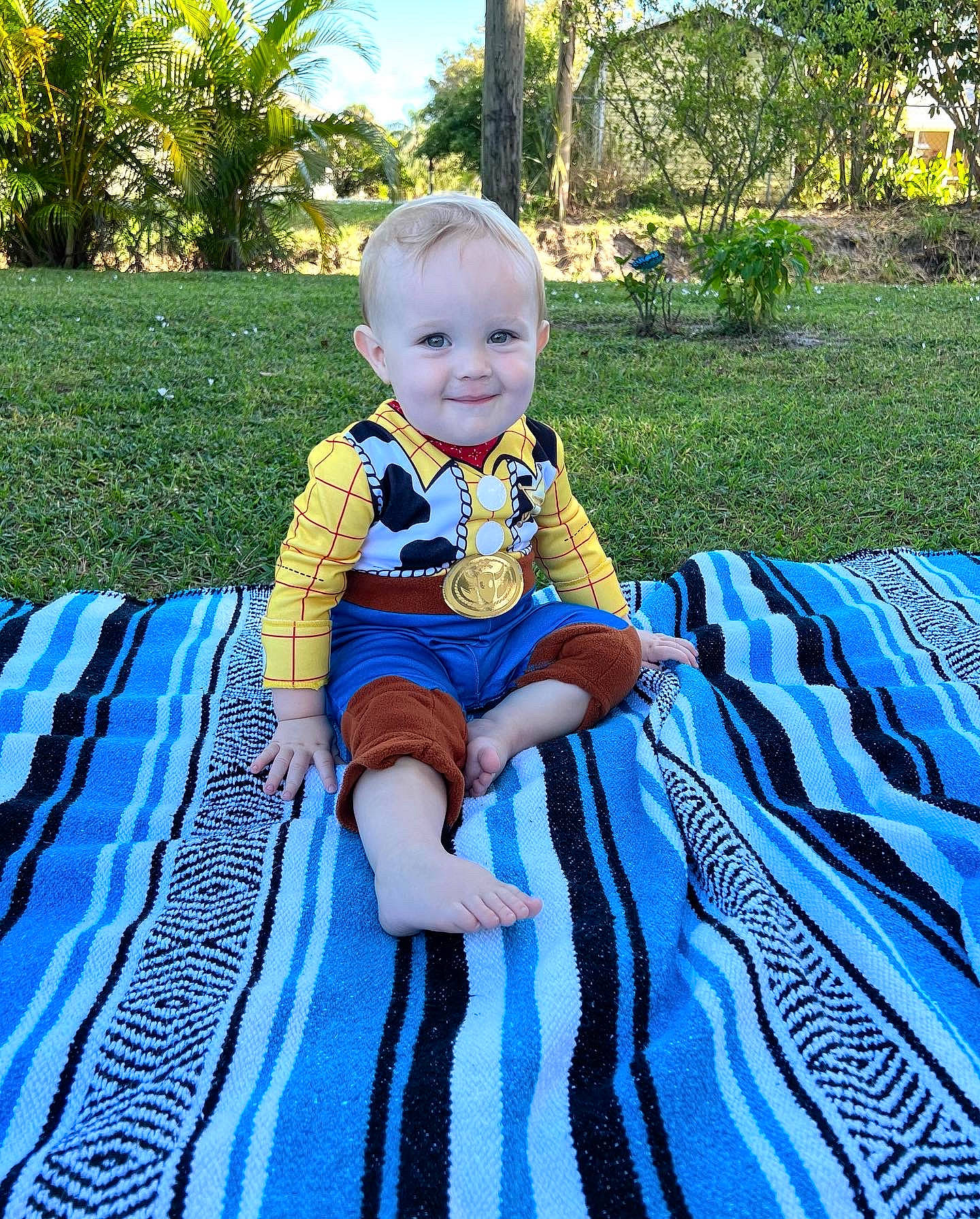 Eli joined the competition — help win amazing prizes! baby, baby_toddler_clothing, blue, botany, electric_blue, fun, garden, grass, happy, joy, leisure, outdoor_furniture, pattern, people_in_nature, person, plant, play, recreation, sitting, smile