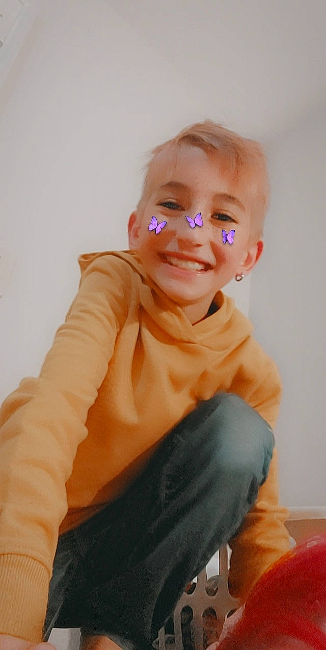 Jayden joined the competition — help win amazing prizes! arm, baby_toddler_clothing, cheek, child, chin, eye, face, finger, flash_photography, gesture, happy, head, human_body, joy, neck, nose, orange, person, skin, sleeve