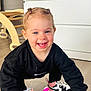 éva participe au concours pour gagner de l'argent avec cette photo : black_clothing, child, crouching, cute, dresser, floor, furniture, hair_ties, happy, indoor, nike, person, pigtails, playful, smiling, sneakers, toddler, toothbrush, toy, wooden_floor