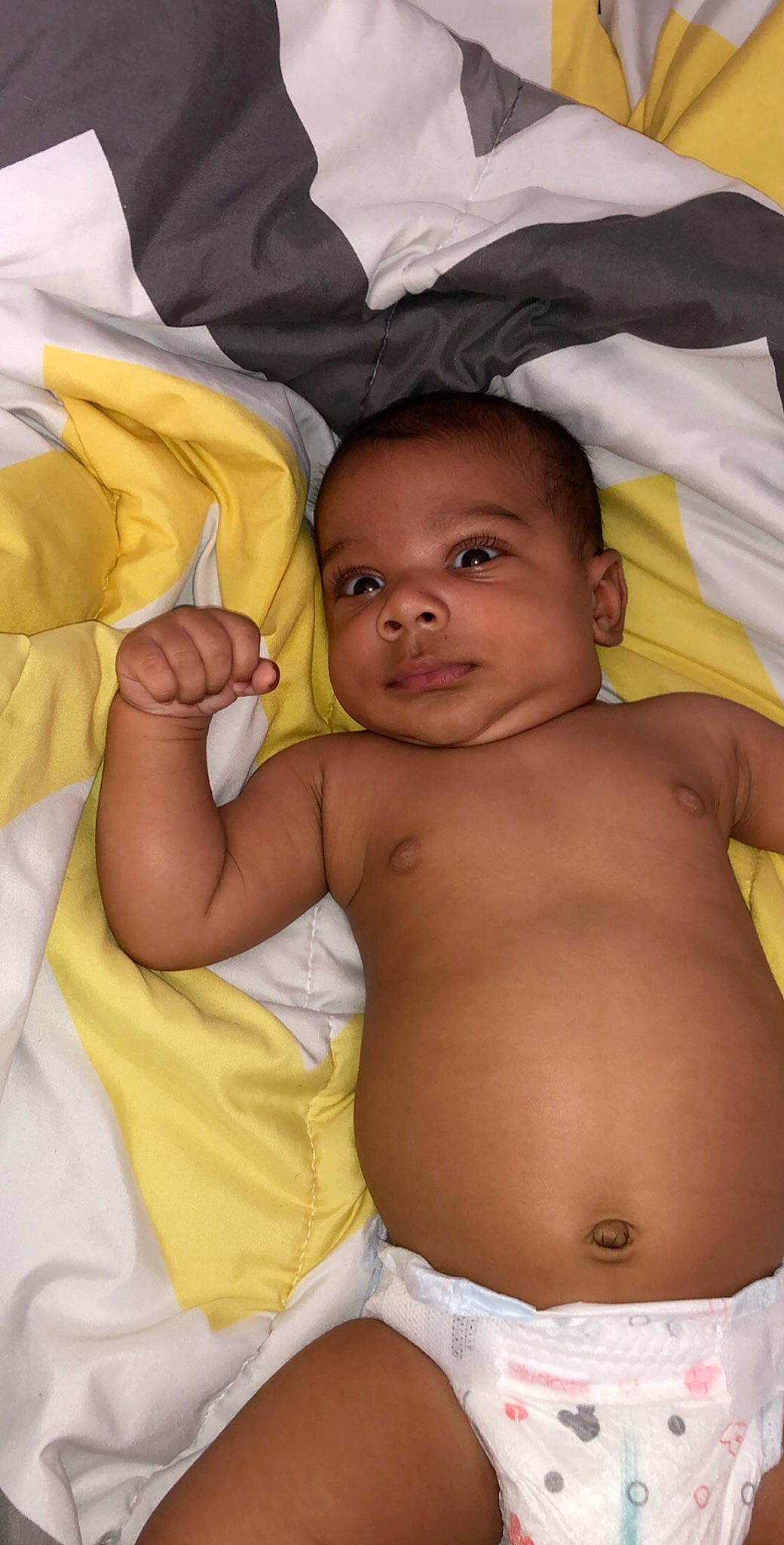 Deandre is registered to the contest to win money with this photo: abdomen, baby, barechested, chest, child, eye, human_body, linens, muscle, navel, neck, organ, person, skin, stomach, toddler, trunk, yellow