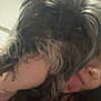 dog, person, close_up, selfie, cuddle, fur, face, tongue, hair, indoor, pet, friendly, affection, animal, cute, companion, blurred, cozy, casual, playful