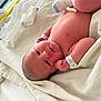 Luka joined the competition — help win amazing prizes! newborn, baby, infant, hospital, blanket, pacifier, sock, skin, lying_down, bed, hospital_id_band, towel, resting, indoors, cute, small, person, human, soft_light, cozy