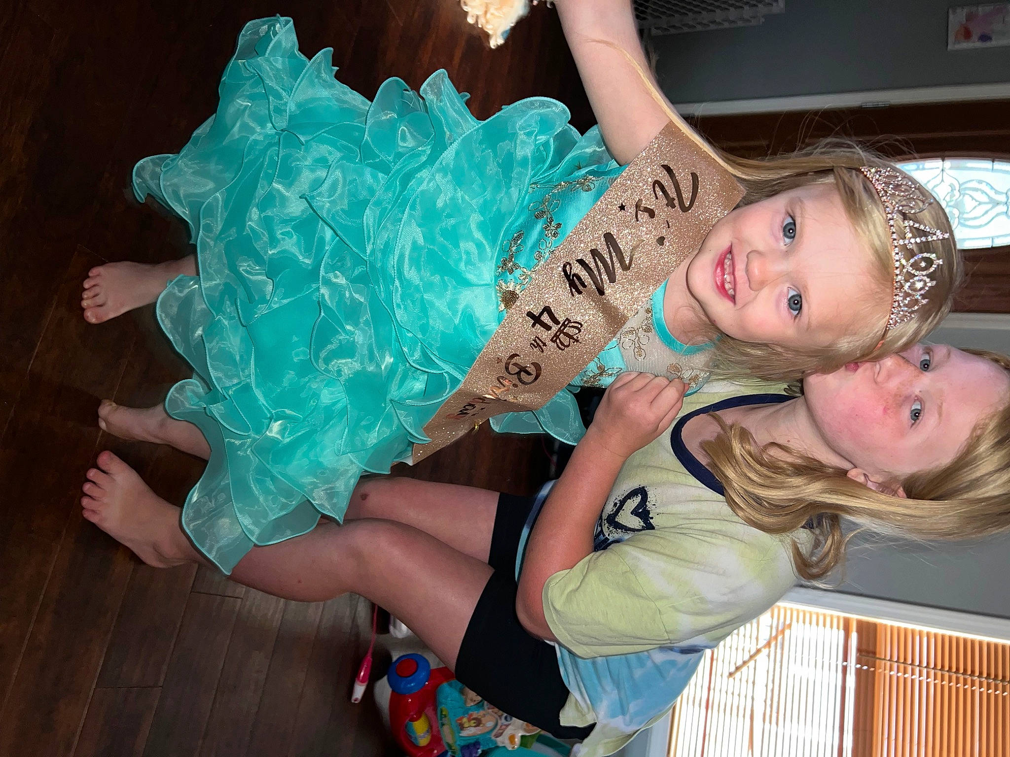 Trinity joined the competition — help win amazing prizes! abdomen, child, costume, electric_blue, eyelash, fashion_accessory, flash_photography, fun, happy, headpiece, human_leg, jewellery, joy, mythical_creature, nail, person, pink, plastic, sitting, smile