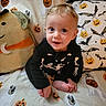 Hunter joined the competition — help win amazing prizes! baby, child, infant, sitting, smiling, portrait, halloween, pumpkin, bat, blanket, bedding, plush_toy, moon, costume, black_clothing, indoors, bedroom, happy, face, photography
