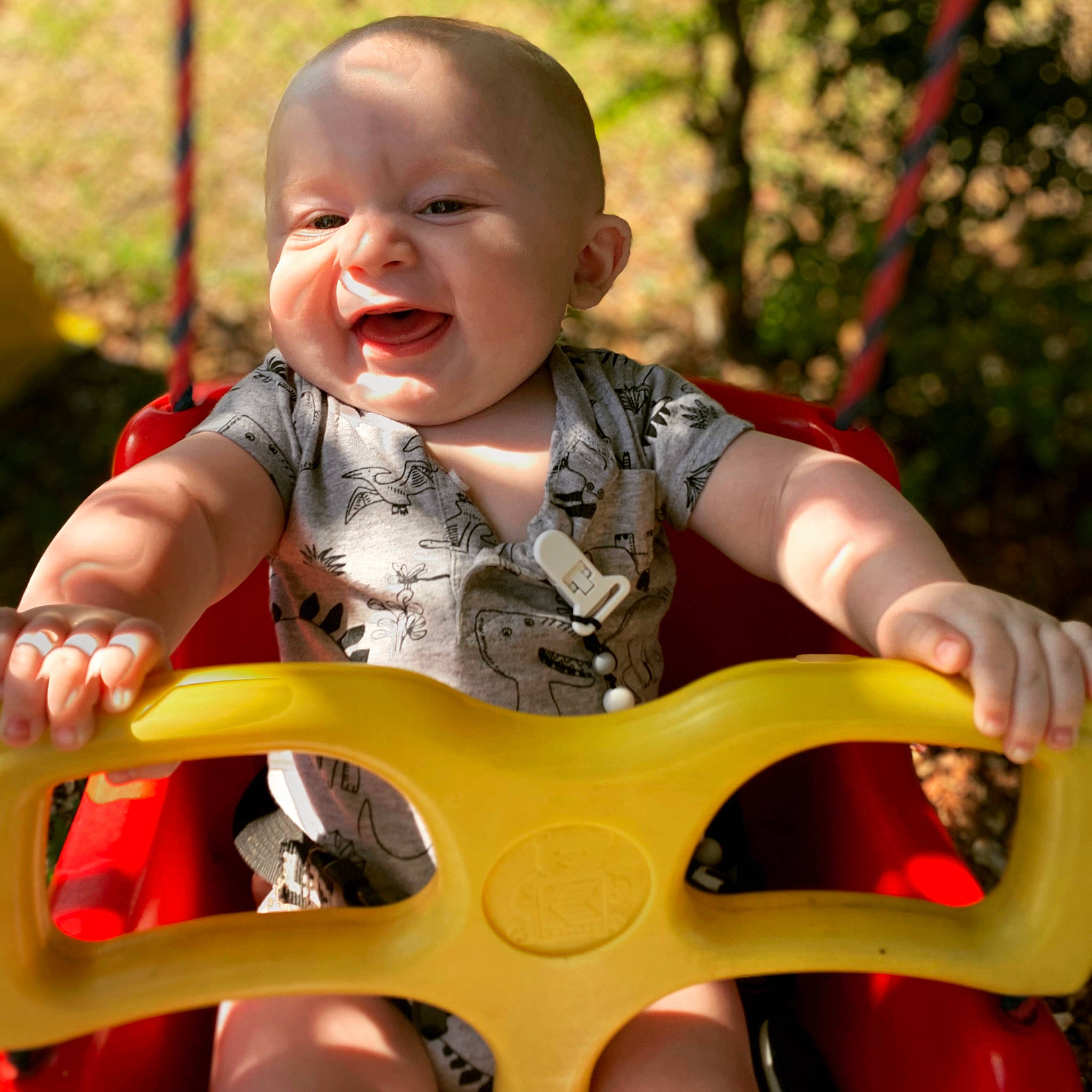 Caine is registered to the contest to win money with this photo: baby, baby_toddler_clothing, child, eye, face, finger, grass, happy, head, human_body, leaf, leisure, people_in_nature, person, photograph, plant, skin, smile, standing, toddler