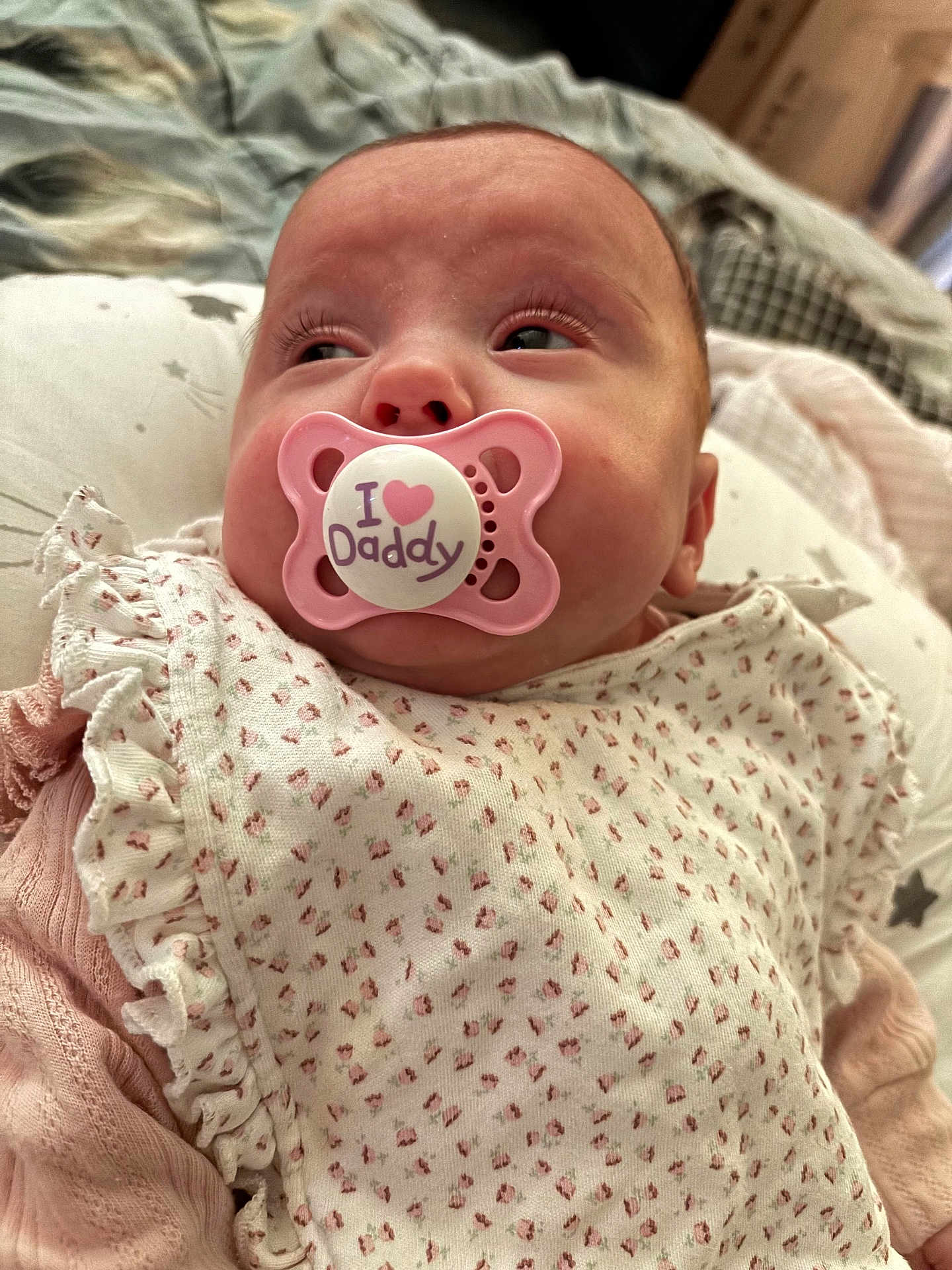 Esmae-Hope joined the competition — help win amazing prizes! baby, pacifier, pink, infant, close_up, face, clothing, pattern, fabric, sleepwear, cute, newborn, soft, indoor, portrait, child, person, resting, young, comfort