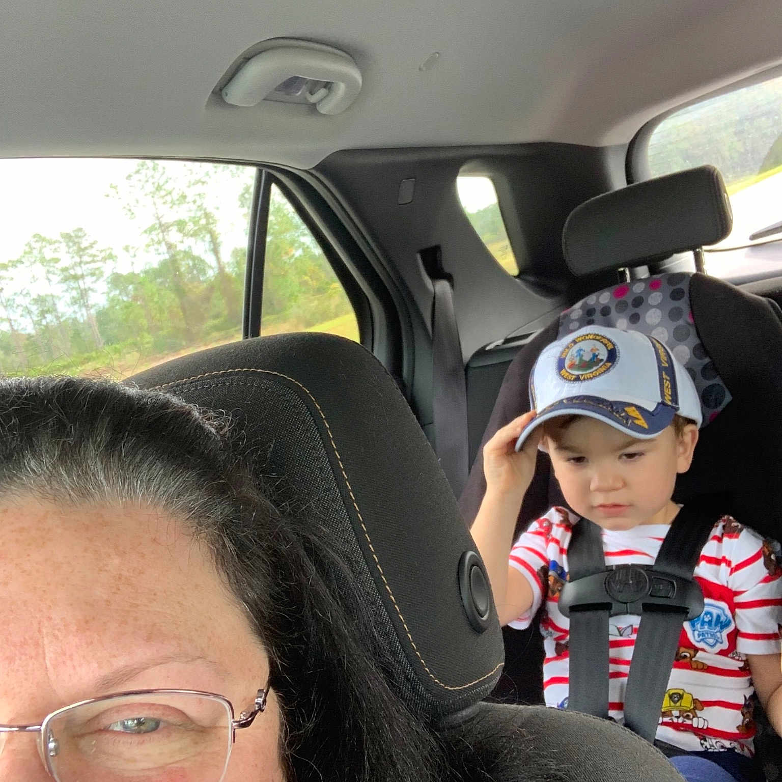 Adien joined the competition — help win amazing prizes! automotive_exterior, car, cool, driving, eyewear, family_car, fun, girl, glasses, headgear, headwear, motor_vehicle, person, product, smile, sunglasses, vehicle, vision_care